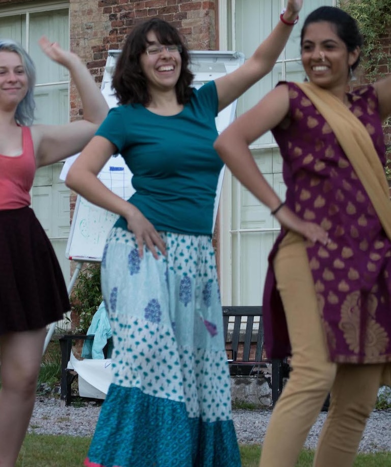 Participants dancing in a line.